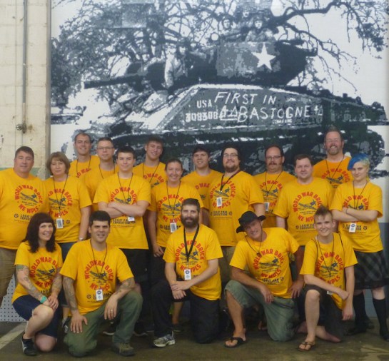 World War Brick staff in front of the mosaic built at WWB 2014